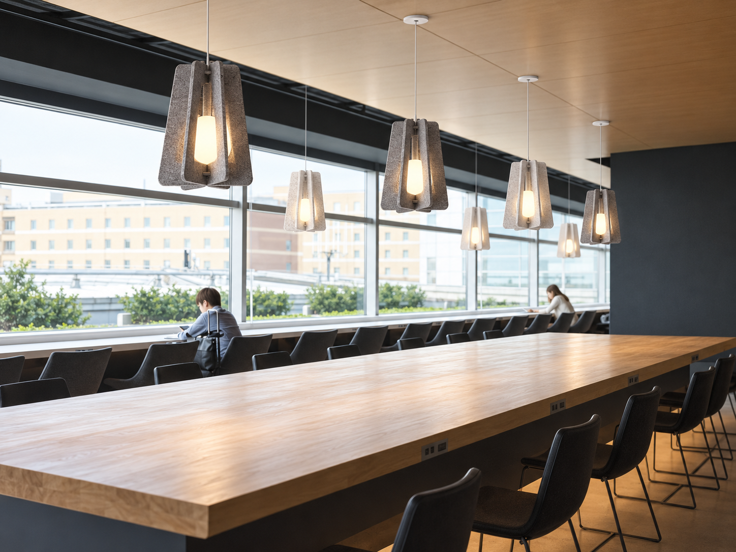 Modern coffee bar with pendant lighting above the service counter and ordering area.